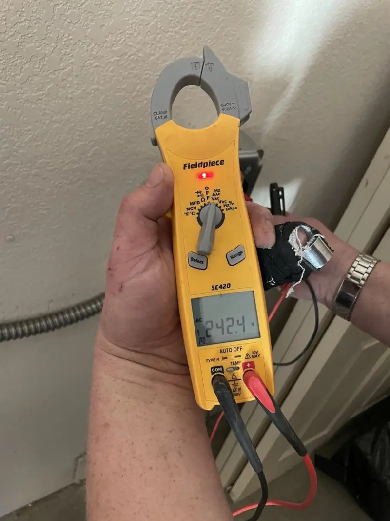 Voltage testing with clamp meter during Whole House Surge Protector in Augusta